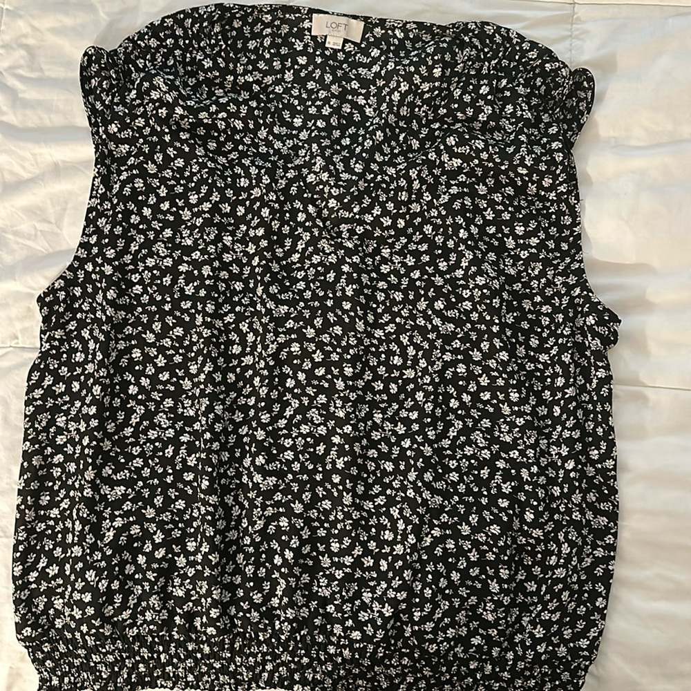 Floral print blouse with banded bottom and shoulder ruching.
